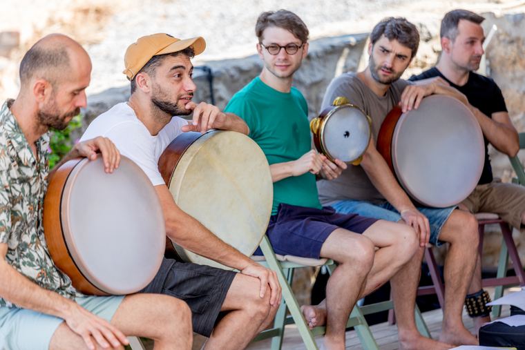 Five students with frame drums